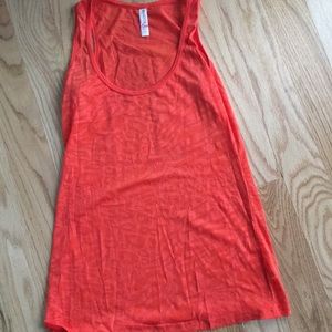 Poppy colored burn out tank. Boutique brand